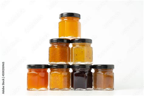 Pyramid of jams. Different jam jars in piramid. Jam set. Different jam ...