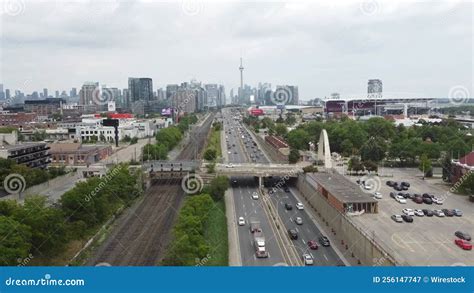 Aerial View of a Highway Road with Traffic with a Modern City on the ...