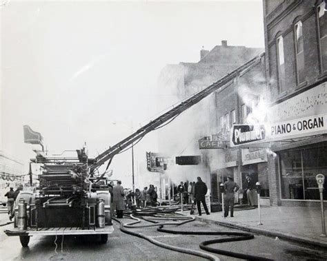 an old fire truck is on the street