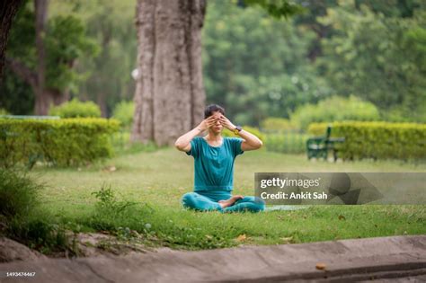 Young Attractive Woman In Doing Yoga And Meditation In Bhramari ...