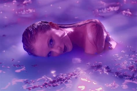 Taylor Swift Gets Sultry in Purple Pool for Lavender Haze Music Video