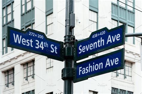 Road signs in midtown of new york featuring 34th, america, and american ...