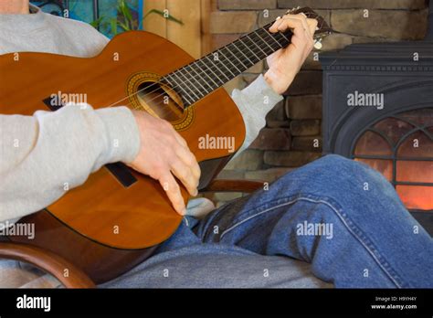 Man Playing Guitar In Front of Fire Stock Photo - Alamy