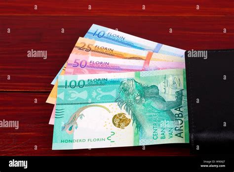 Aruban Florin in the black wallet Stock Photo - Alamy