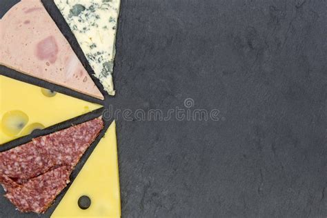 Pizza Topping Cut As Slices of Pizza on Black Slate Top View Stock ...