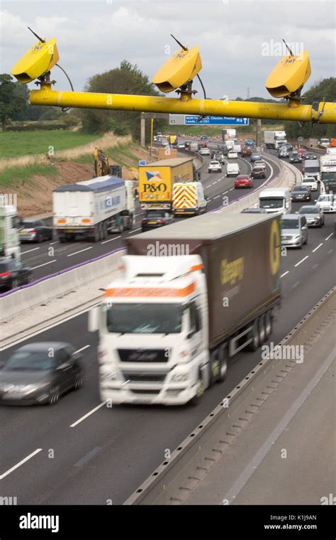 Average speed cameras on the M6 motorway in Cheshire,UK Stock Photo - Alamy