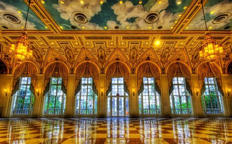 an ornate room with large windows and tiled floor