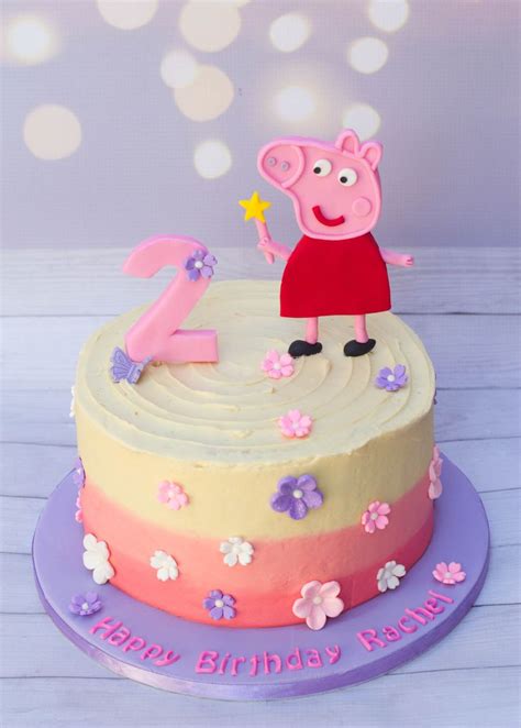 a birthday cake with peppa the pig on top