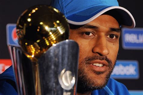 MS Dhoni with the Champions Trophy | ESPNcricinfo.com