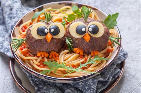 Premium Photo | Spaghetti with funny meatballs for kids