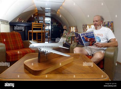 INTERIOR OF LIVING AREA WITH OWNER DAVE DRIMMER. THE PLANE BOAT IS A ...