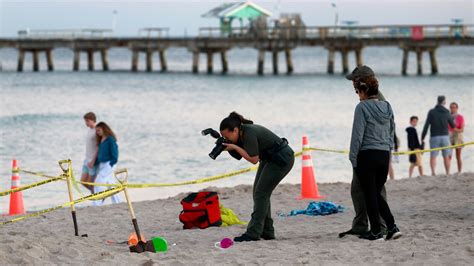 Young girl dies after being buried alive digging sand on Florida beach ...