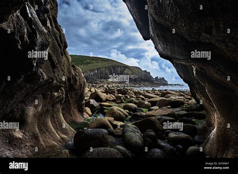 Cave Entrance, Landscape Looking at Headland Stock Photo - Alamy