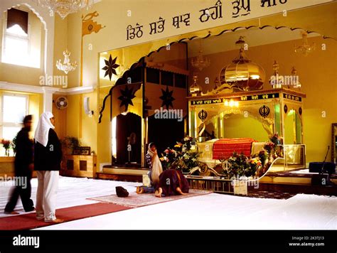 Worshippers Bowing before the Guru Granth Sahib under the Palki Sahib ...