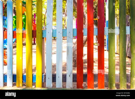 Fencing of various bright colors. The fence stands around the ...