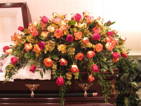 Casket spray of 100 mixed roses in red and two varieties of bi-color ...