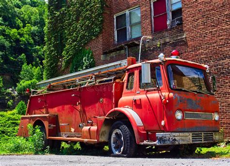 Old abandoned fire engine stock photo. Image of building - 190607628