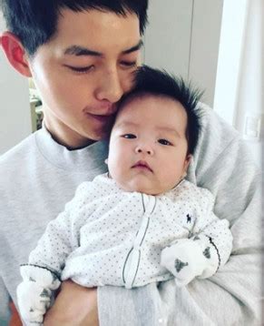 New Photos: Song Joong Ki Showers His Baby Nephew With Fatherly Love