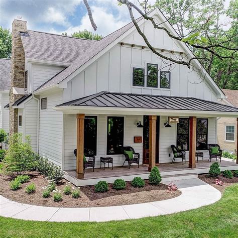 Cute white farmhouse with wood beams and a covered front porch. LOVE ...