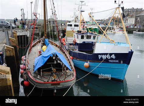 Fishing boats docked in Padstow harbour Cornwall Stock Photo - Alamy