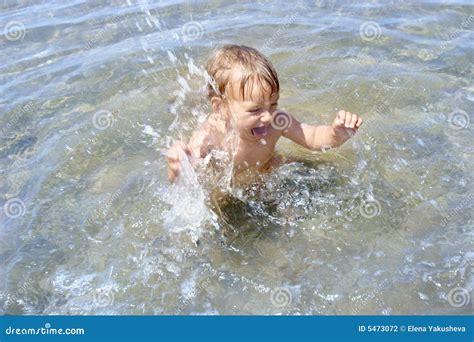 Baby playing in water stock photo. Image of infant, playtime - 5473072