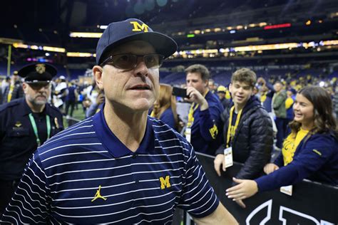 What is Jim Harbaugh's record against Ohio State?