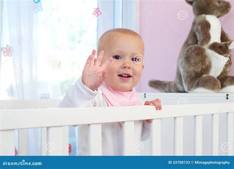 Portrait Of A Cute Baby Smiling And Waving Hello Stock Photos - Image ...