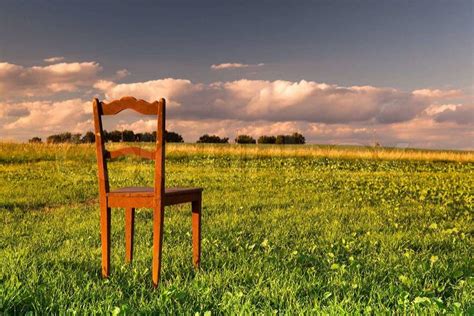 The restless chair on the empty field at sunset | Stock Photo | Colourbox