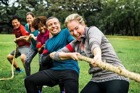 Team competing in tug of war – AllAboutLean.com