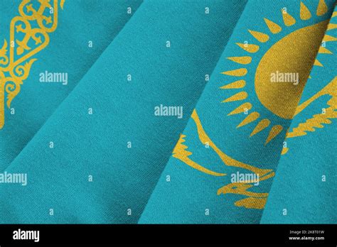 Kazakhstan flag with big folds waving close up under the studio light ...