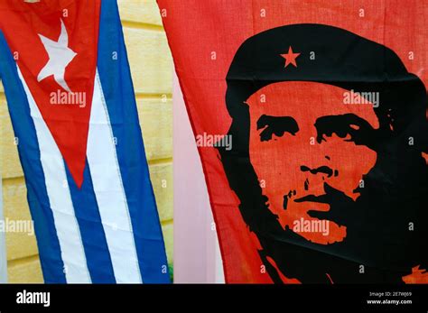 Cuban National Flag with banner of communist icon Che Guevara, Cuba ...