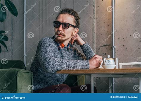 Alone Young Man in Glasses Sit in Cafe, Turning Around As If he is ...