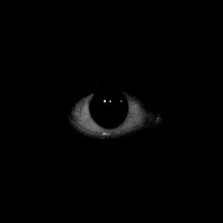 an eye is shown in the dark