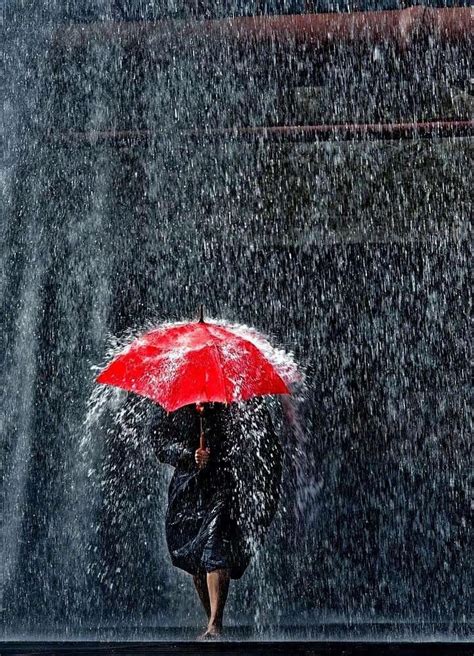 Woman holding a red umbrella & walking in the rain | Rainy day ...