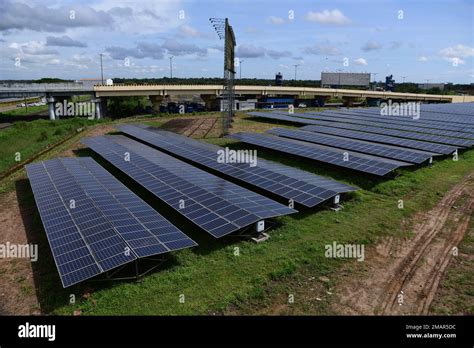 Solar panels sit outside the Cochin International Airport that boasts ...