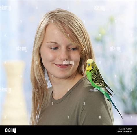 Girl pet bird on shoulder hi-res stock photography and images - Alamy