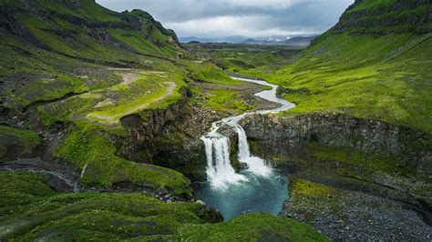 Waterfall at the gates of Okmok at Umnak, Aleutian Islands, Alaska, USA ...