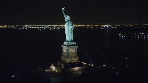 Orbiting the Statue of Liberty at Night in New York Aerial Stock ...