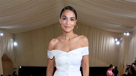 Alexandria Ocasio-Cortez Wears "Tax The Rich" Gown to 2021 Met Gala