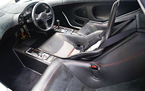 Mclaren f1 interior, the driver sits in the middle and there are two ...