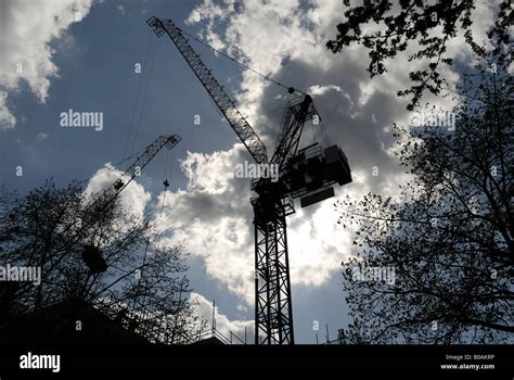 Cranes at construction site Stock Photo - Alamy