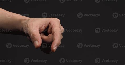 Man's hand in a holding gesture isolated on black background 2642845 ...