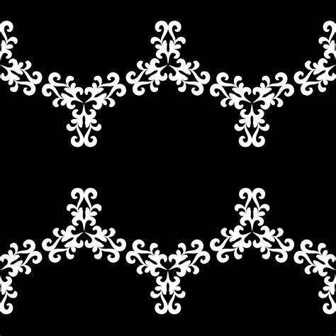 White ornament with floral elements on a black background. Antique ...