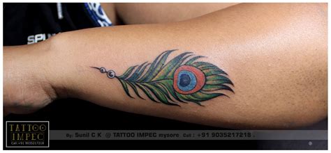 Pin on Tattoo's piercings want/like | Wrist tattoos for guys, Peacock ...