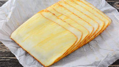 The Real Reason Not Every Deli Cheese Slice Is Square