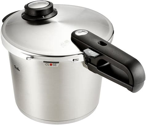 a stainless steel pressure cooker with lid open