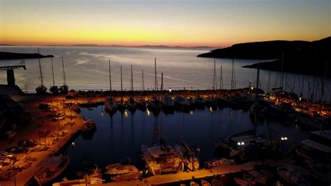 Sunset over a boat harbor. - YouTube