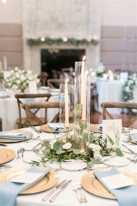 elegant simplicity in this reception centerpiece of eucalyptus and ...