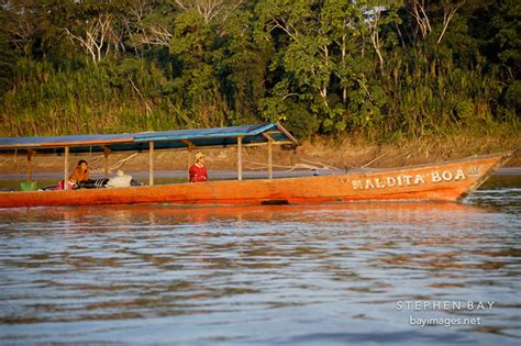 Photo: Boat traveling on the Madre de Dios river. Amazon, Peru.