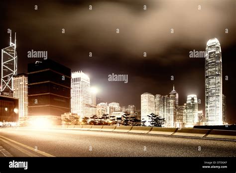 Highway and city at night Stock Photo - Alamy